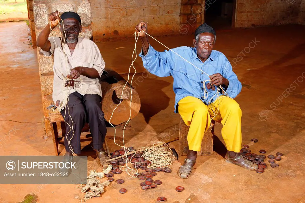 Men making traditional foot and hand rattles, Juju Rattles from Uyot, Bafut, Cameroon, Africa