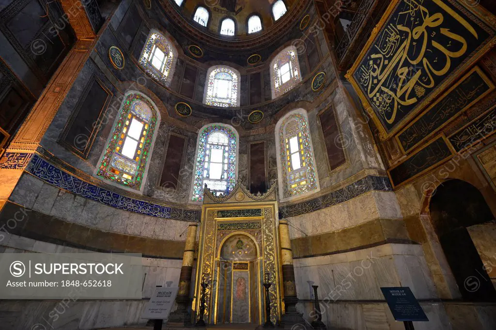 Interior view, Hagia Sophia, Ayasofya, Islamic prayer niche, mihrab, for Muslim ritual prayer, whitewashed mosaic of the Archangel Gabriel, UNESCO Wor...
