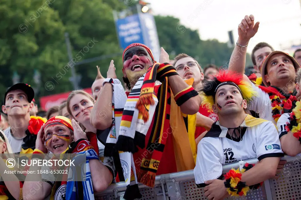Fans at the Euro 2012 public viewing event on the Berlin Fan Mile watching the quarter final match at the Brandenburg Gate, Berlin, Germany, Europe