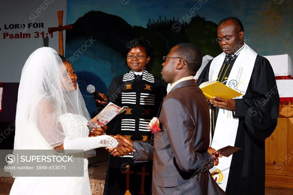 Bride and groom taking their wedding vows, Bamenda, Cameroon, Africa