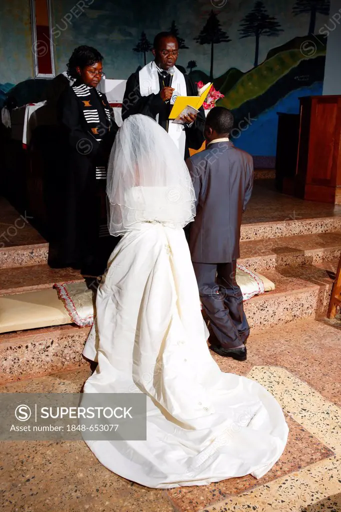 Bride and groom taking their wedding vows, Bamenda, Cameroon, Africa