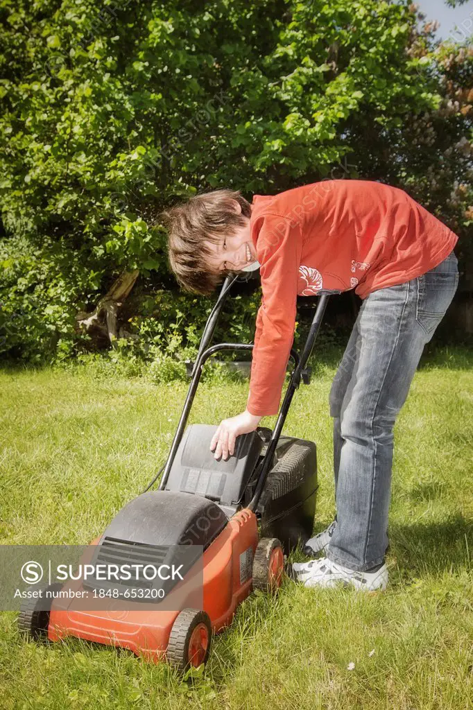 Boy with a lawnmower