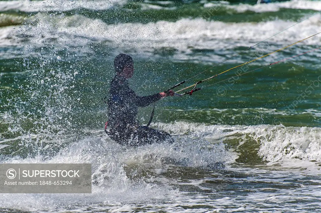 Kite surfer in strong wind in the surf, Warnemuende, Mecklenburg-Western Pomerania, Germany, Europe