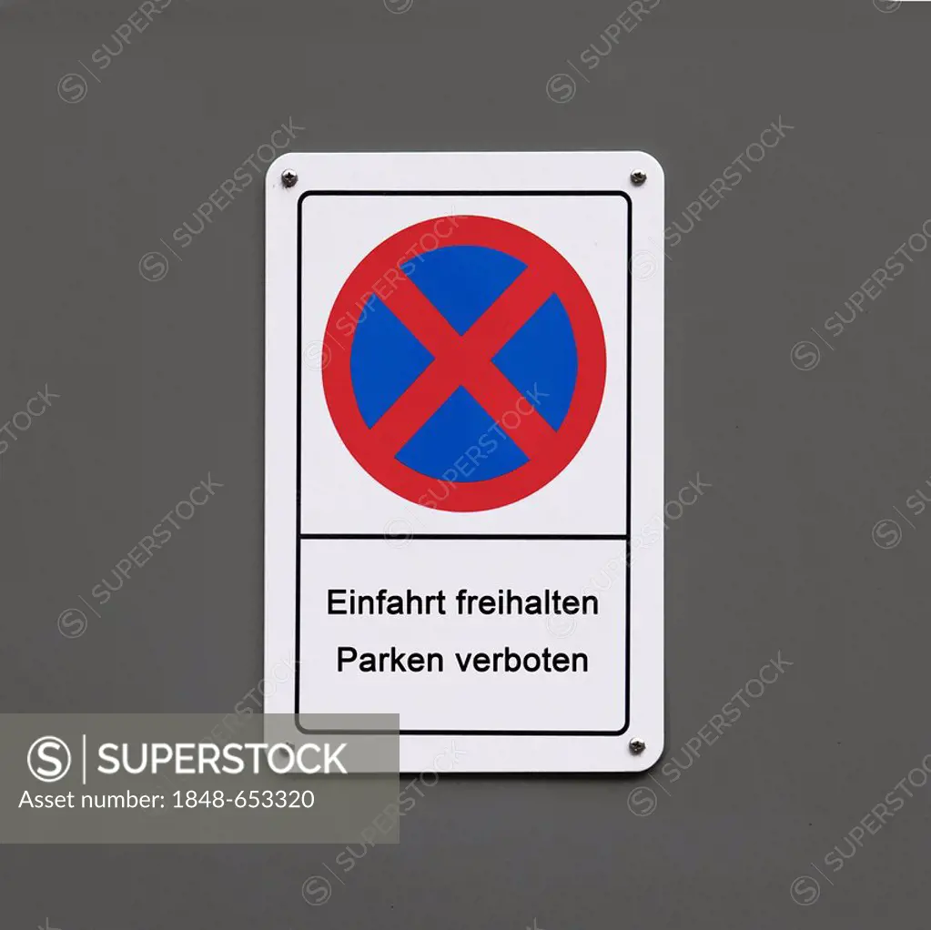 Sign Einfahrt freihalten, Parken verboten, German for keep clear, no parking, on a grey wall, PublicGround