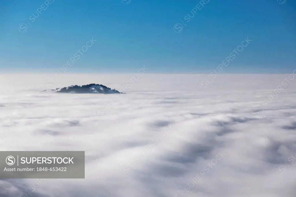 The Hundwiler Hoehe or Hoehi in a sea of mist in the Swiss Alps in Appenzell, Switzerland, Europe