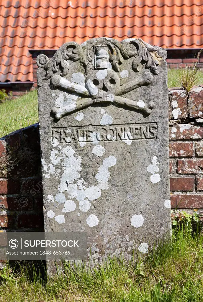 Historic grave at the cemetery of St. Magnus Church in Tating, the oldest church in Eiderstedt, Schleswig-Holstein, Germany, Europe