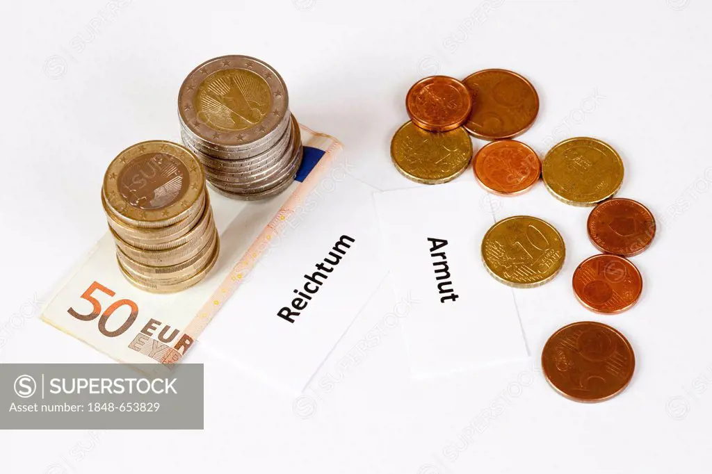 Signs Reichtum and Armut, German for wealth and poverty, stacked euro coins on euro banknotes, symbolic image for income gap