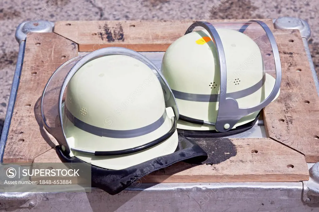 Fire fighters' helmets, crate