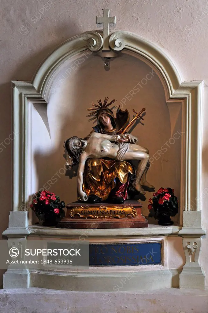 Pietà, colourful sculpture of Maria with the body of Jesus, in a niche of St. Peter's Church, St Peter's district, Salzburg, Salzburg province, Austri...