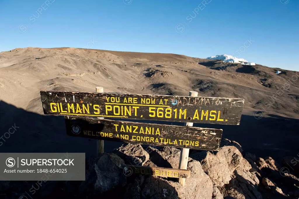 Trekking, mountain climbing, sign at the summit of Gilman's Point, stepped glacier on the crater rim, Kilimanjaro, Marangu Route, Tanzania, East Afric...