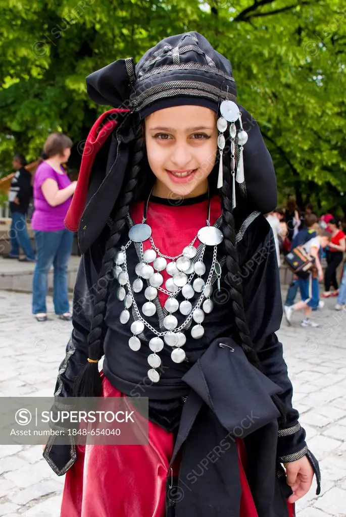 Girl wearing a costume, dancing, Sighnaghi, Kakheti province, Georgia, Caucasus region, Middle East