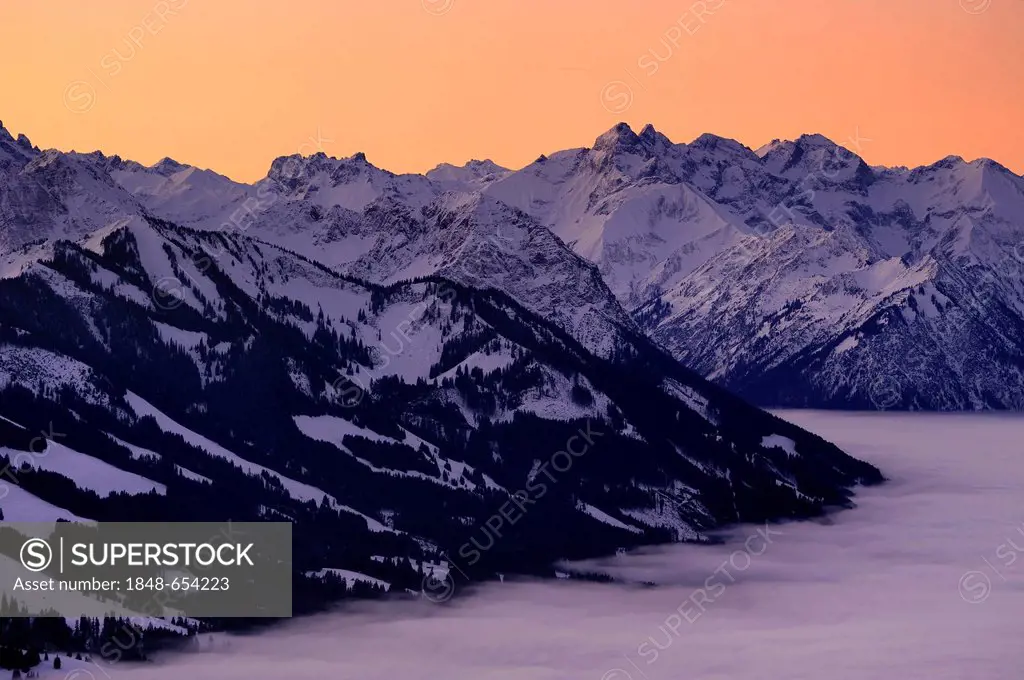 Sunrise above mountain tops with fog in winter, Sonthofen, Allgaeu, Bavaria, Germany, Europe
