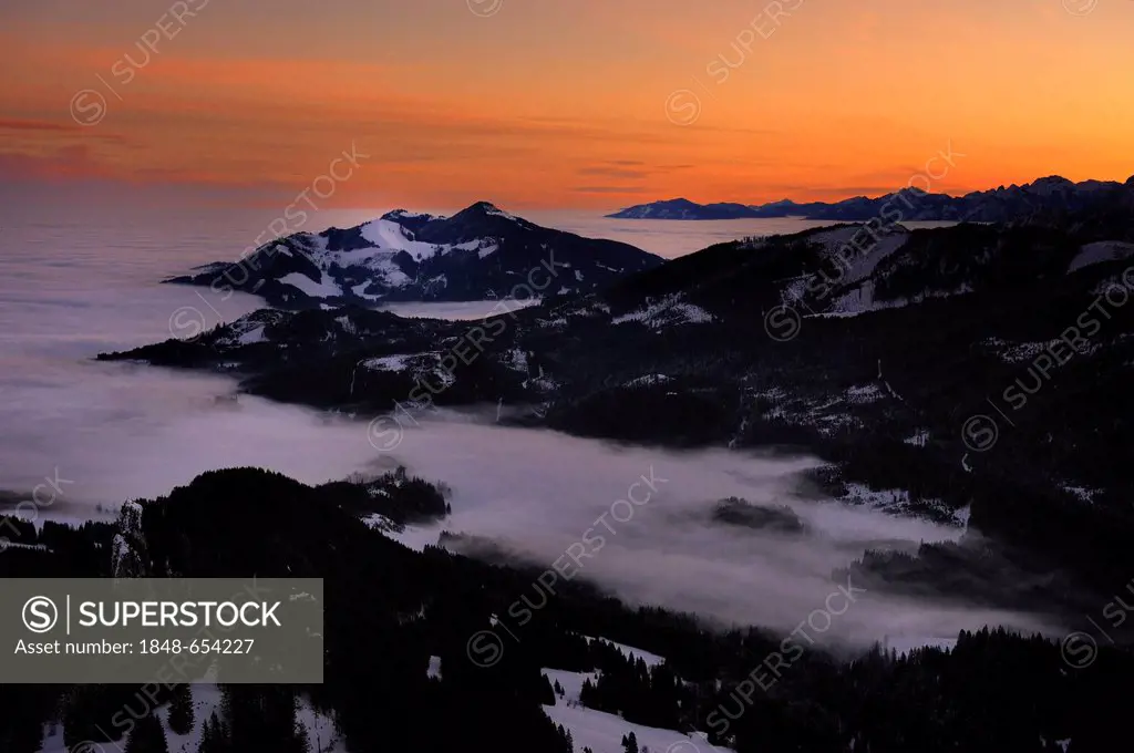 Sunrise above mountain tops with fog in winter, Sonthofen, Allgaeu, Bavaria, Germany, Europe