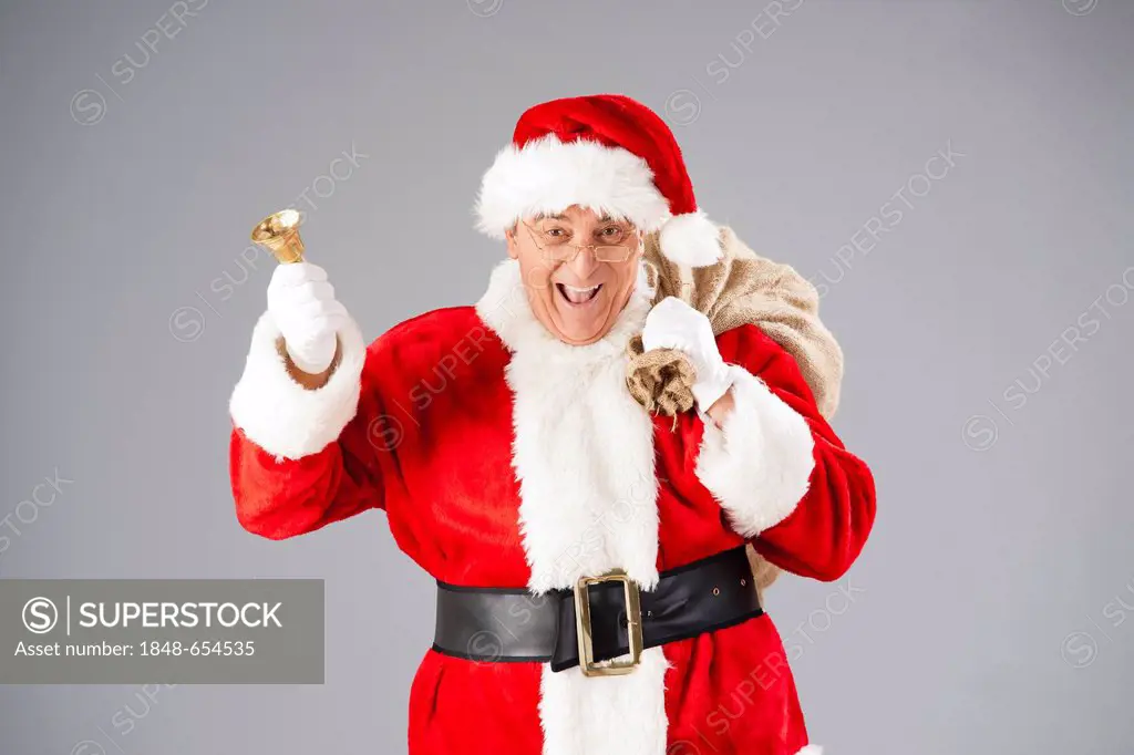 Santa Claus with a bag and a bell