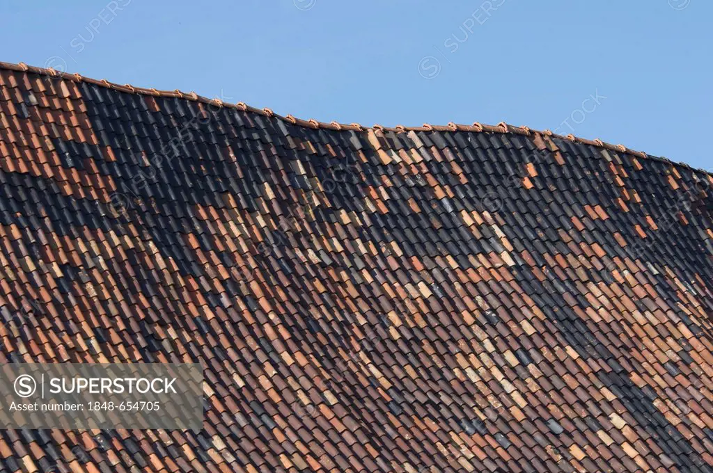 Old roof ridge, contorted gable, many replaced roof tiles, restoration