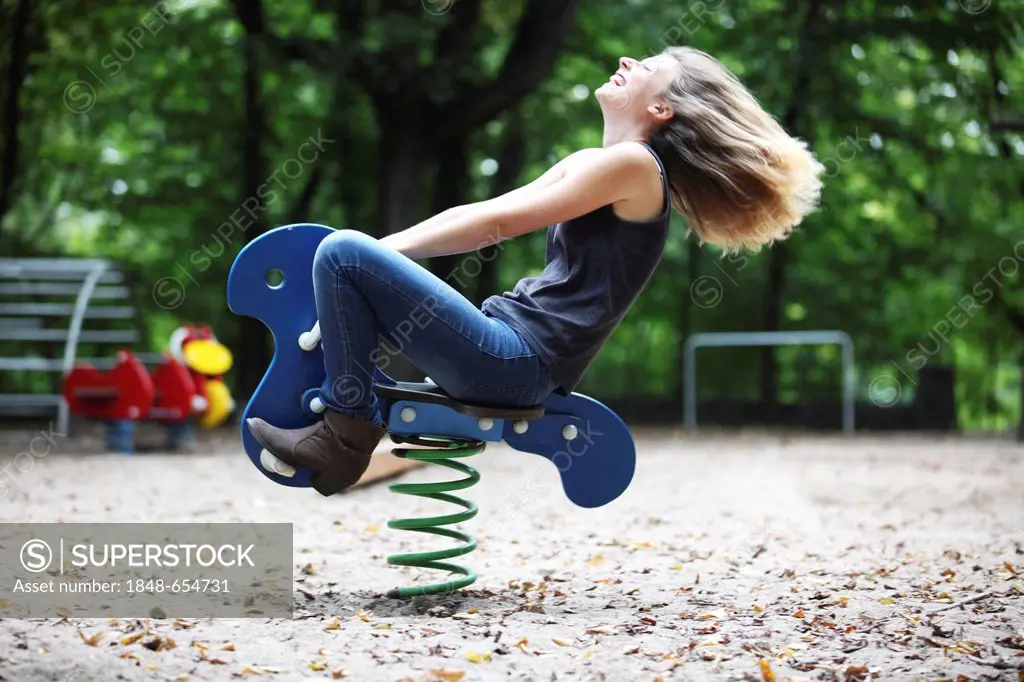 Young woman on a children's playground