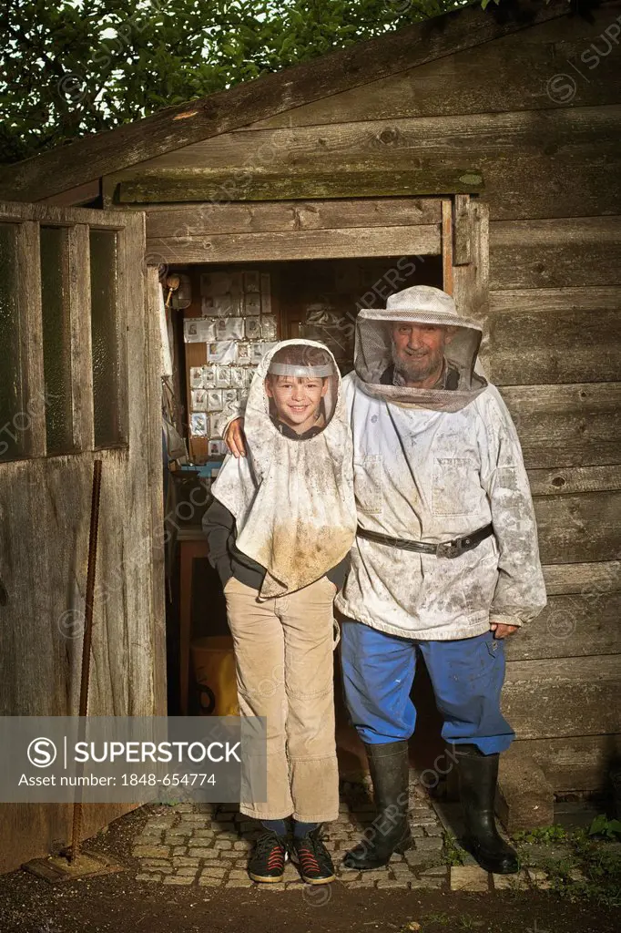 Beekeeper with apprentice beekeeper