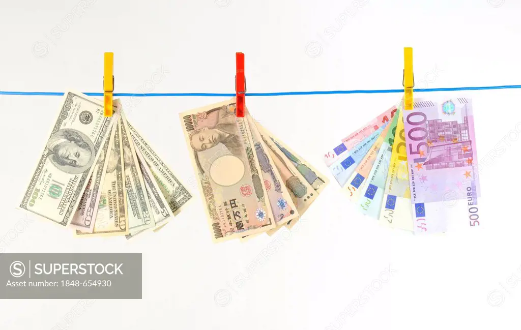 Euro, U.S. dollars and Japanese yen, notes on a clothesline, symbolic image for money laundering, dirty money, exchange rate