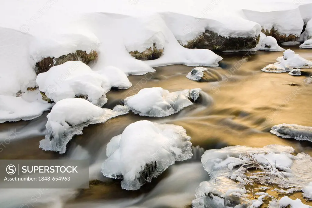 Flowing mountain stream in winter, South Tyrol, Italy, Europe