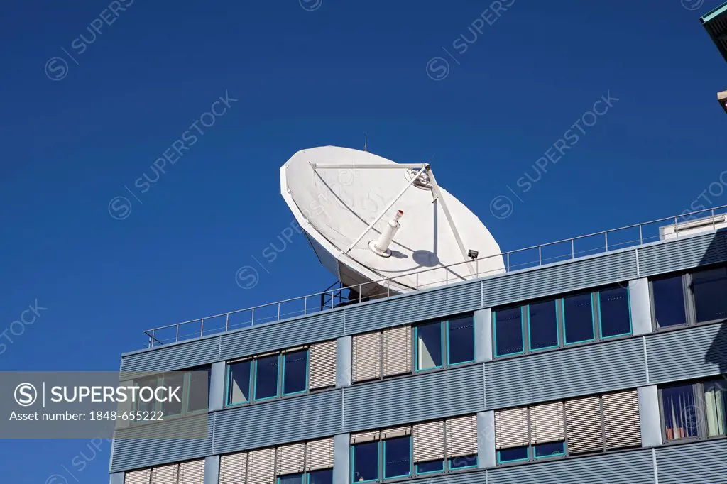 Satellite dish of the German television stations VOX, n-tv, Super RTL and CBC on the Medienzentrum Koeln-Ossendorf complex, Cologne, North Rhine-Westp...