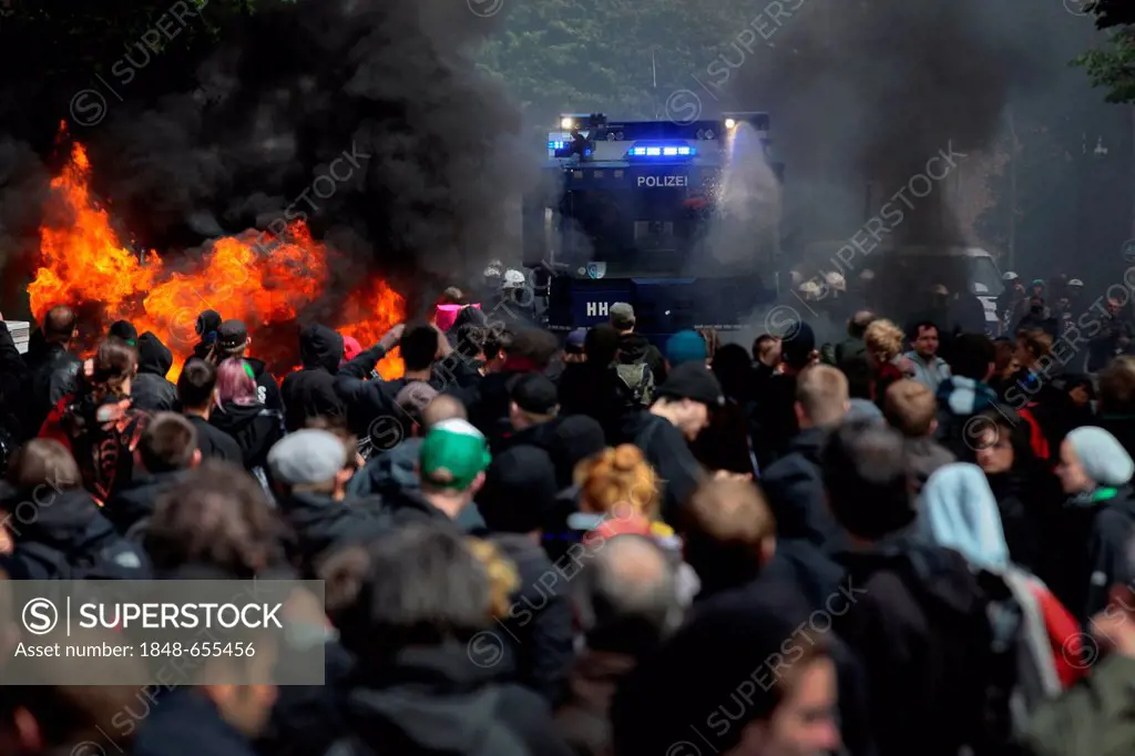 Use of water cannon against anti-Nazi protesters, the left-wing protesters tried to stop a rally of neo-Nazis with burning barricades, amongst others,...