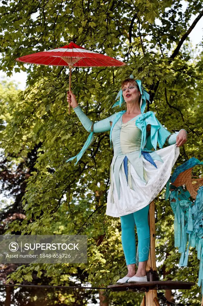 Artist on a high wire, tightrope, in costume, dance rope theatre, Flachsmarkt, flax market, Krefeld-Linn, Lower Rhine region, North Rhine-Westphalia, ...