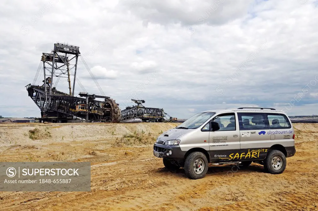 Safari by jeep in front of a Bucket-wheel excavator in the open pit Welzow-Sued, mining of brown coal by the Vattenfall energy company, Lower Lusatia,...