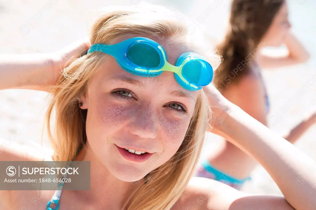 Girl wearing swim goggles, portrait