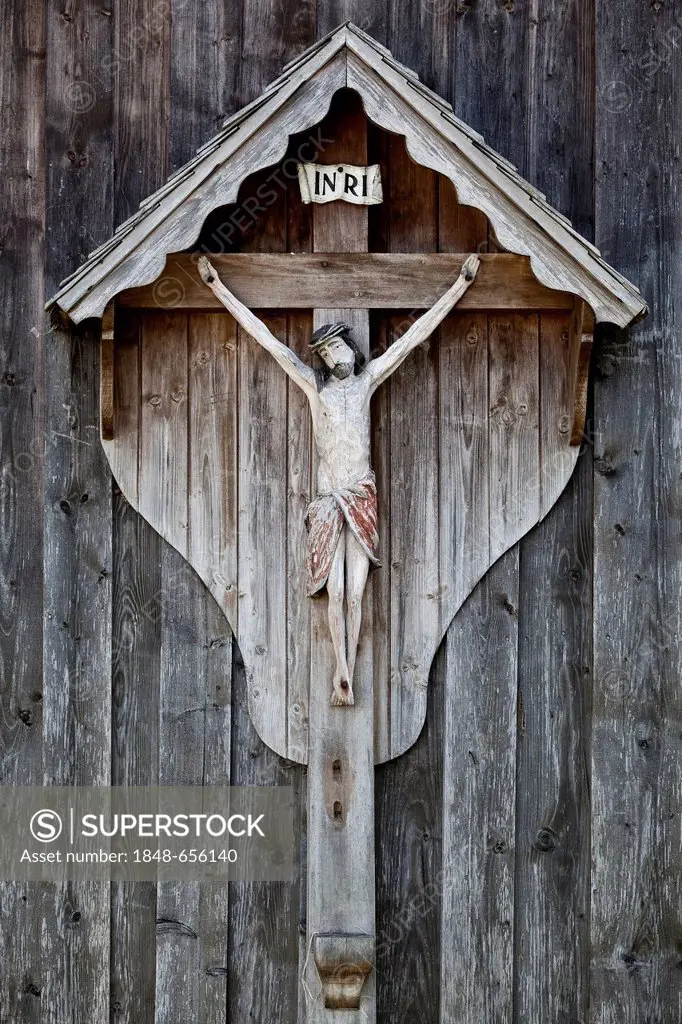 Wooden crucifix on a barn