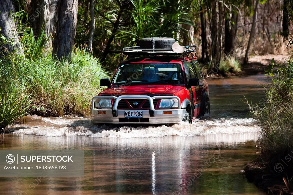 Four-wheel vehicle crossing a river in Litchfield National Park, Northern Territory, Australia