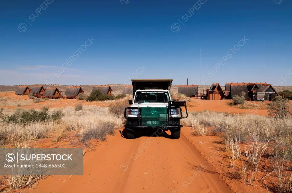 Jeep and accommodation, !Xaus Lodge, Kgalagadi Transfrontier Park, Kalahari Desert, Northern Cape, South Africa, Africa