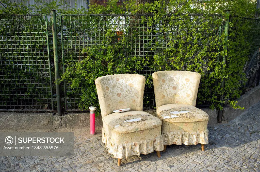 Two armchairs on a pavement, Berlin, Germany, Europe