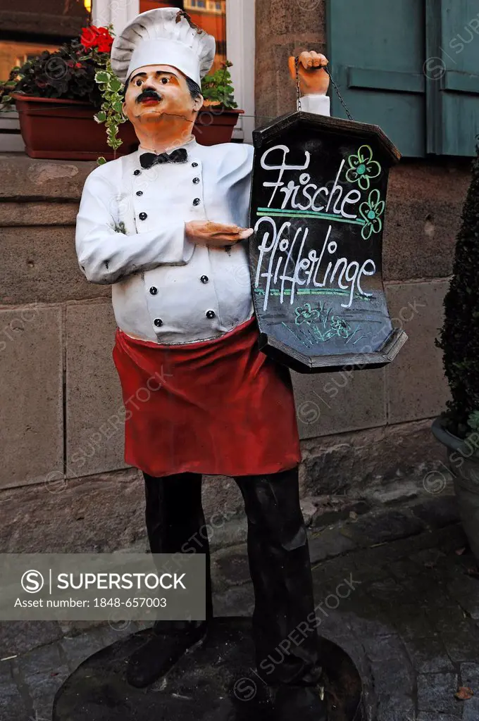 Chef figure with menue board standing in front of a restaurant, Abenberg, Middle Franconia, Bavaria, Germany, Europe