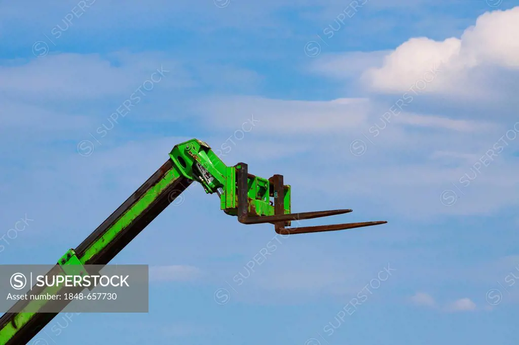 Forklift truck against a blue sky, Berlin, Germany, Europe