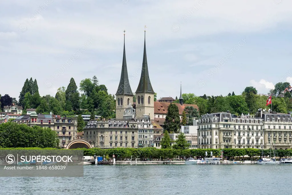 View of Hofkirche St. Leodegar church with the steeples and the historic district of Lucerne seen across Lake Lucerne, canton of Lucerne, Switzerland,...
