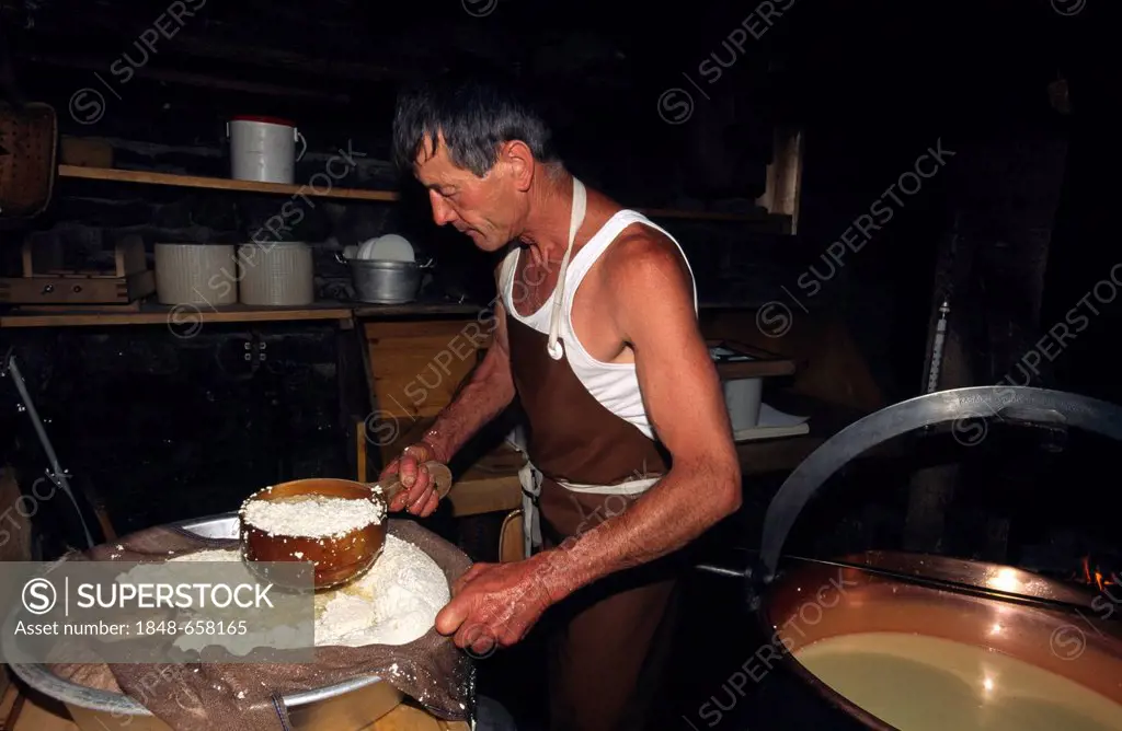 Cheese maker producing cheese in a cheese dairy, Ballenberg open air museum, Bernese Oberland, Switzerland, Europe