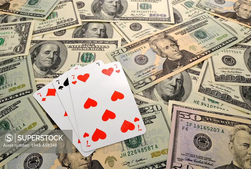 Symbolic image, gambling, dollar bills, playing cards, Blackjack, triple seven, 21