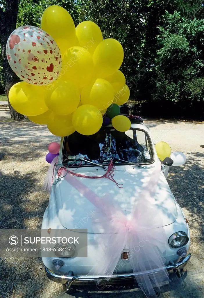 Small wedding car, old Fiat 500 decorated with balloons, Montecatini Terme, Tuscany, Italy, Europe