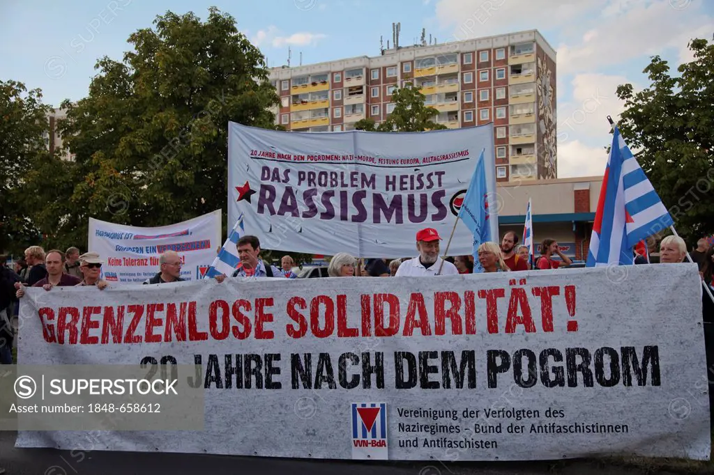 Thousands of people protesting against racism, Sonnenblumenhaus building at the back, where the massive right-wing riots took place in 1992, Rostock-L...