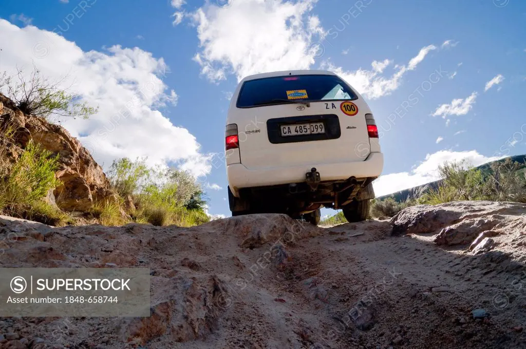 Vehicle travelling on a gravel road, Baviaanskloof, Eastern Cape, South Africa, Africa