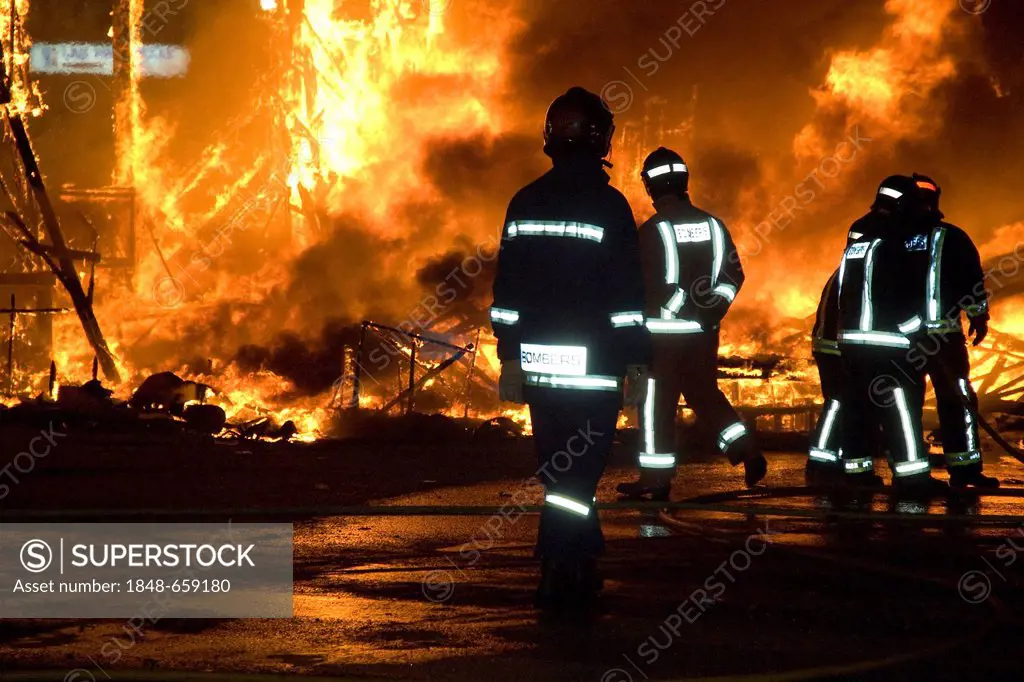 Firefighters wearing protective suits, putting out a fire at the festival, Fallas festival, Falles festival in Valencia in early spring, Spain, Europe