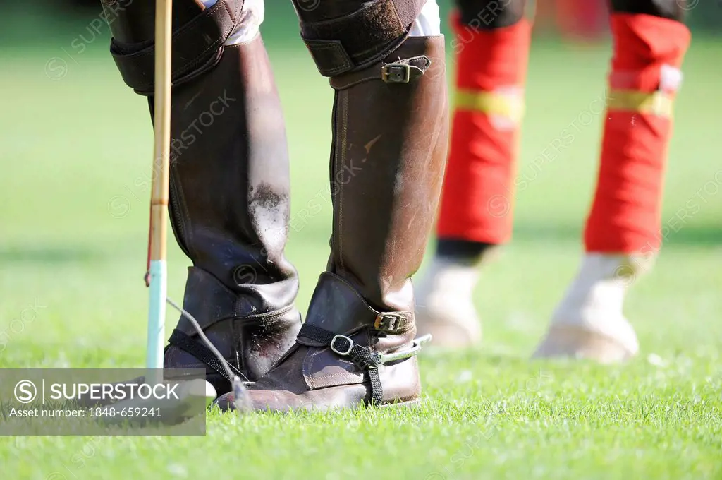 Polo player, boots and stick