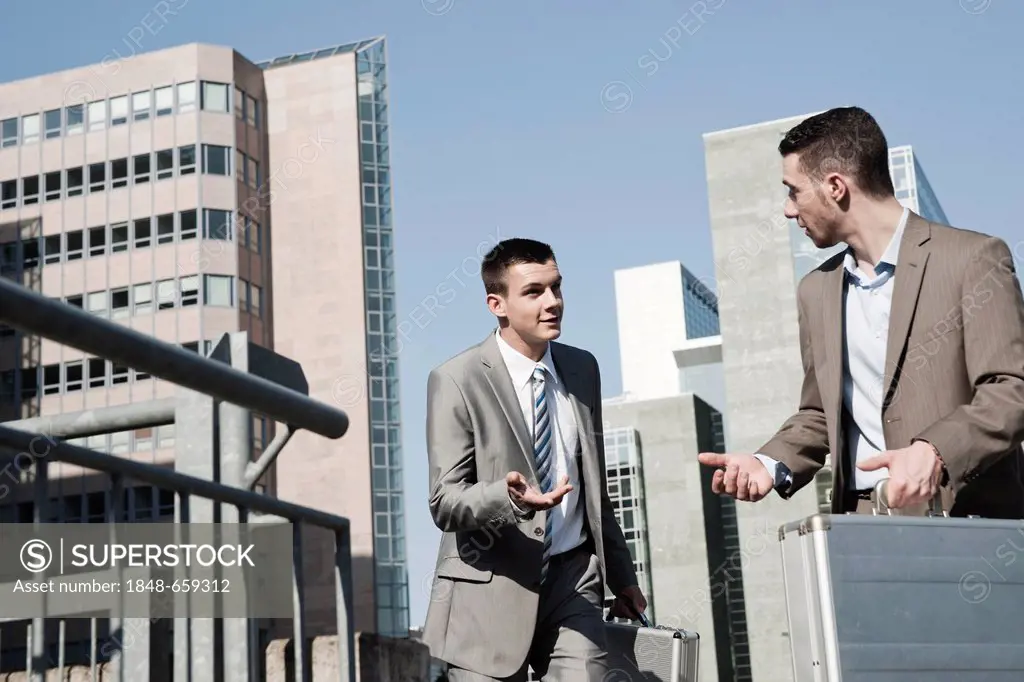 Two businessmen rushing to an appointment