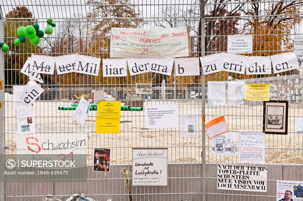 Protest posters against Stuttgart 21 railway project on a site fence in the Schlossgarten, castle gardens, Stuttgart, Baden-Wuerttemberg, Germany, Eur...