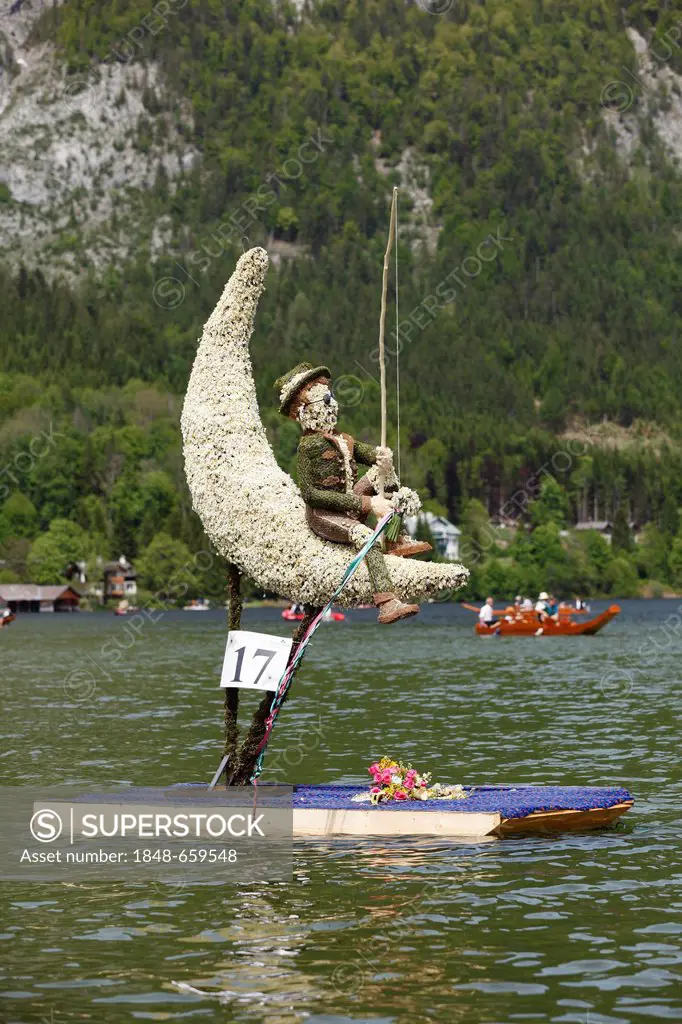 Man in the moon, figure made of daffodils, boat parade on lake Altausseer See, Daffodil Festival, Altaussee near Bad Aussee, Ausseerland, Styrian Salz...