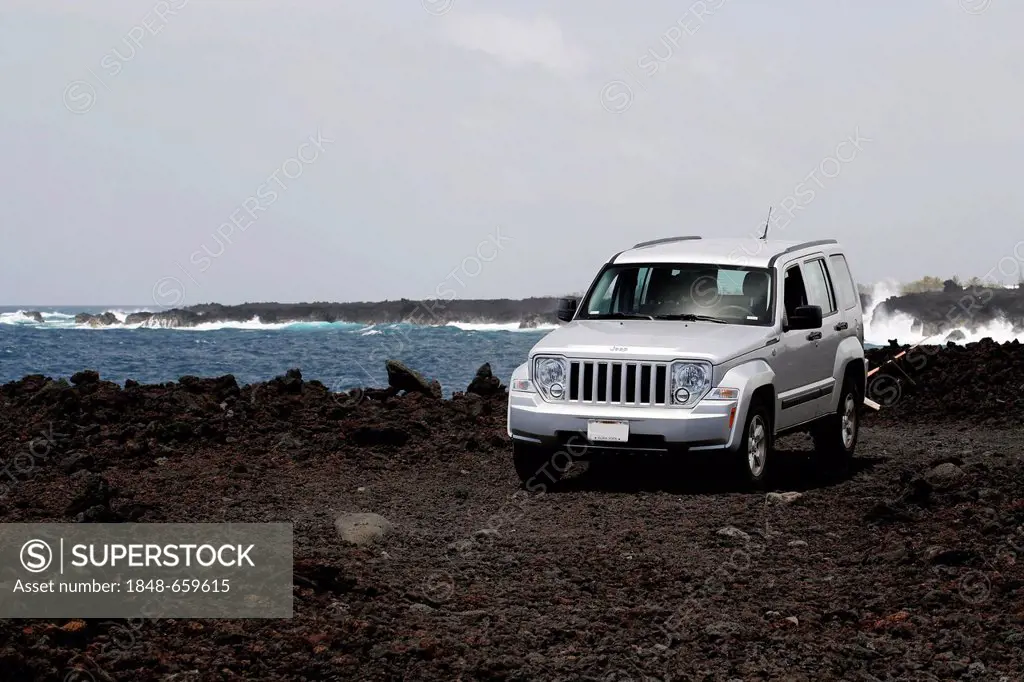 Jeep, four-wheel vehicle on lava road, Big Island, Hawaii, USA