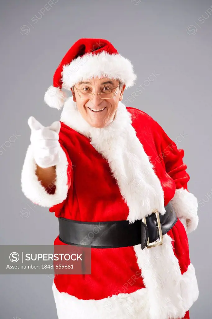 Santa Claus with a raised index finger