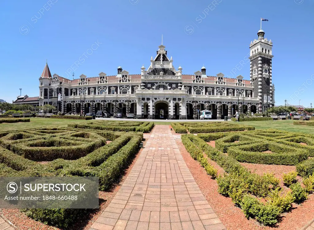 Garden in front of the historic Dunedin Railway Station, Dunedin, South Island, New Zealand, Oceania