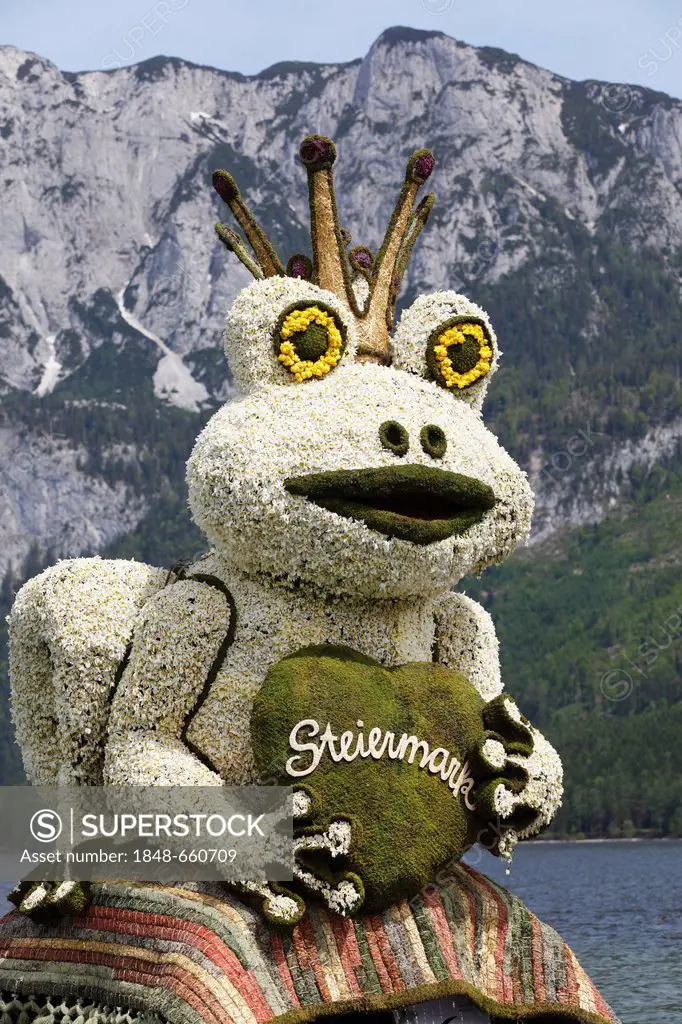 Frog Prince figure made of daffodils, boat parade on lake Altausseer See, Daffodil Festival, Altaussee near Bad Aussee, Ausseerland, Styrian Salzkamme...