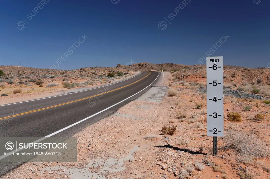 Warning sign, danger of flash floods on a desert road in Nevada, USA